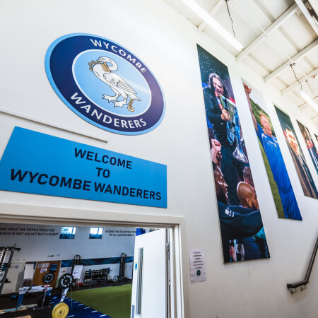 Banners and graphics on the wall up the stairwell.