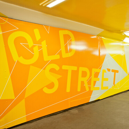 Old Street Underground wayfinding yellow wall