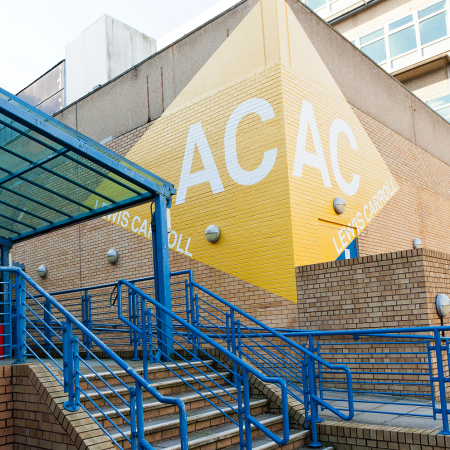 University of Surrey Wayfinding graphics installed on brick walls