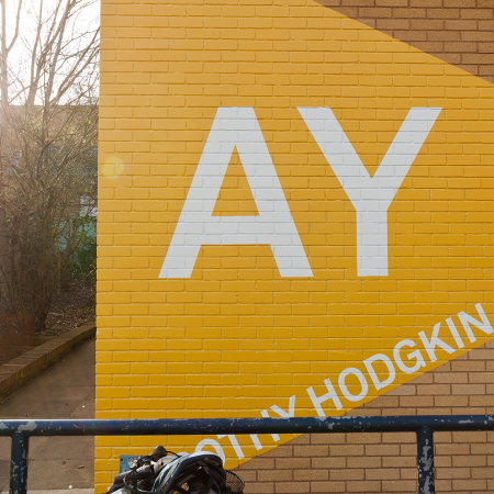 University of Surrey Wayfinding AY installed on brick wall