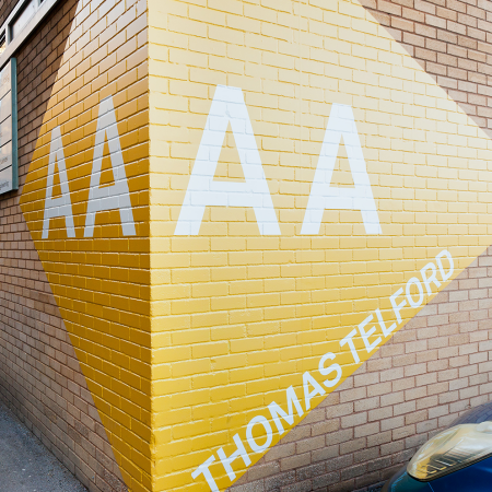 University of Surrey Wayfinding AA installed on brick wall