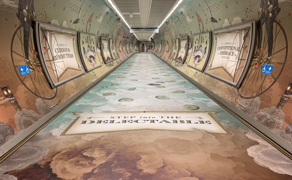 St Pancras tube station tunnel with Hendricks scented print graphics