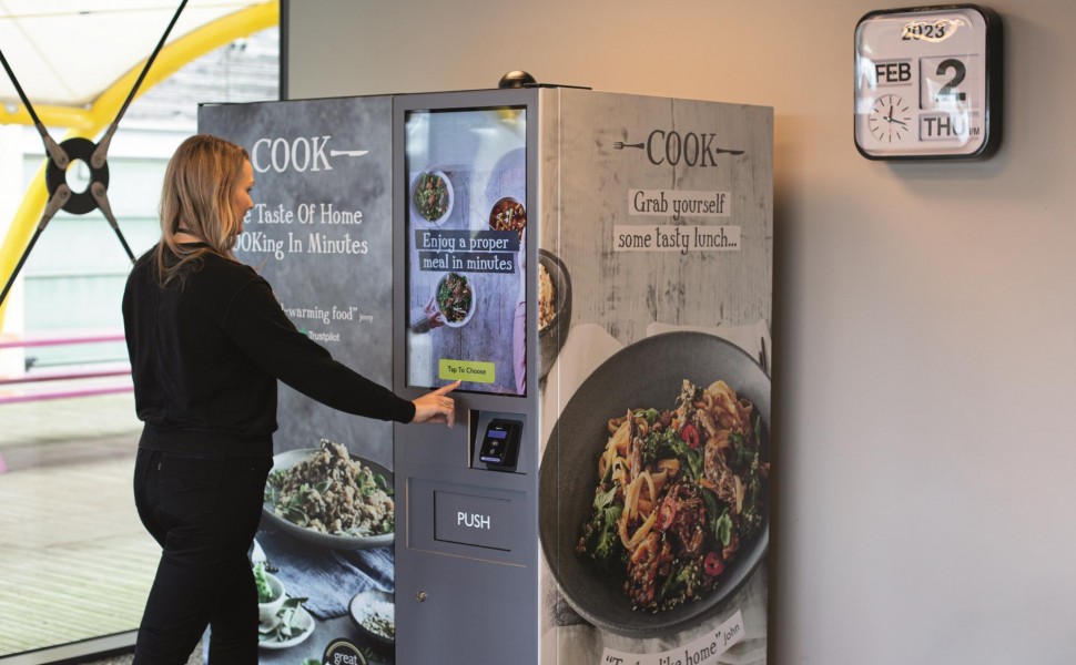 Lady at vending machine.