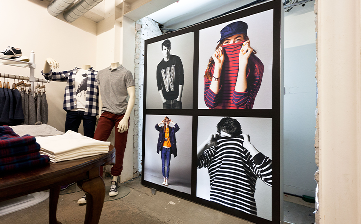 Printed graphics featuring models in a clothing shop