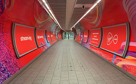 Virgin Media graphics inside a tunnel in London King's Cross Station