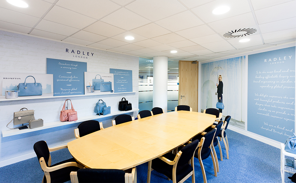 Radley Head Office meeting room with wall graphics and bags
