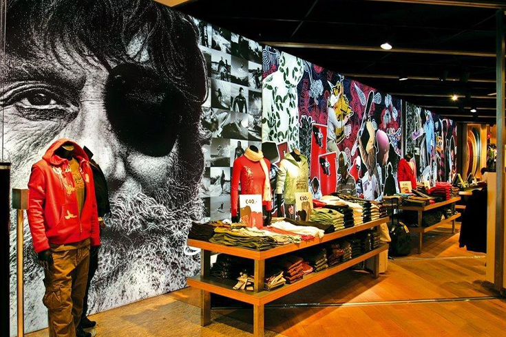 Bright and eye-catching graphics behind clothes displays