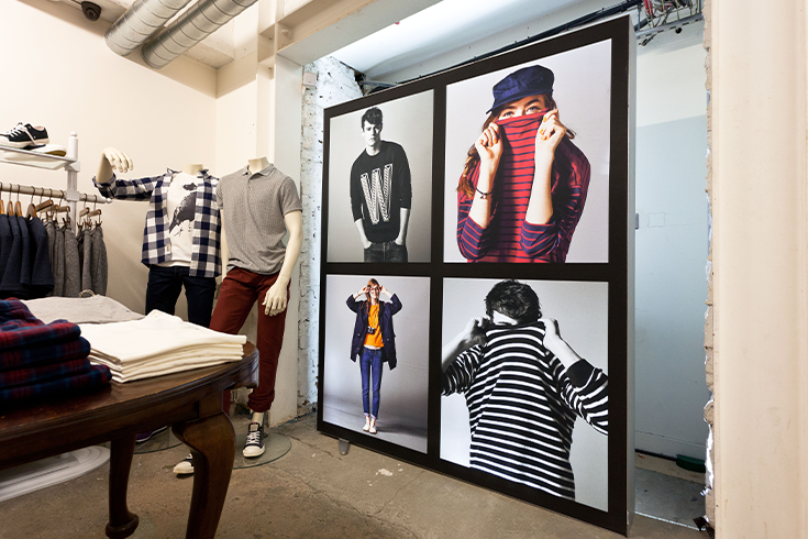 Printed graphics featuring models in a clothing shop